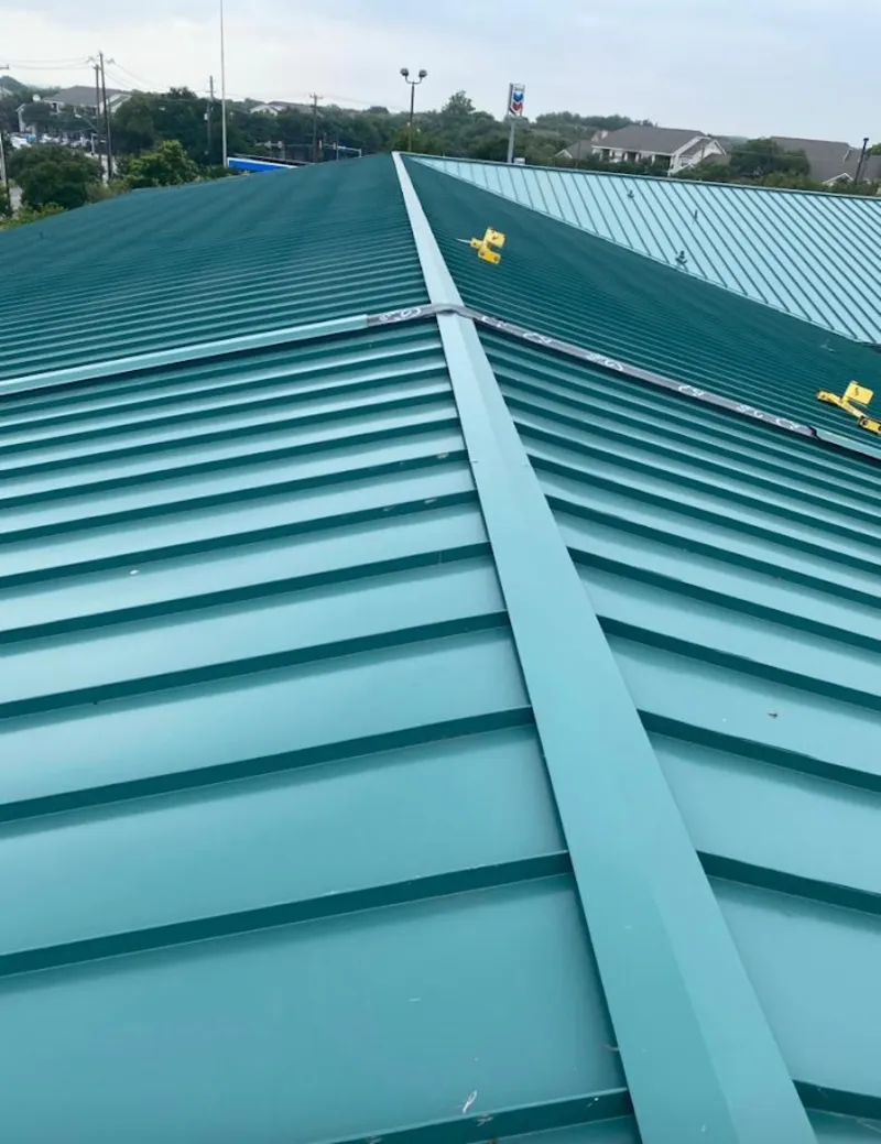 Green commercial metal roof ridge and valley for Metal Roof Repair in Roscoe